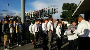 Football players line up to sign a jersey to be presented to the family of Britton Shipp, St. George, Utah, Nov. 2, 2014 | Photo by Denise Webster, St. George News