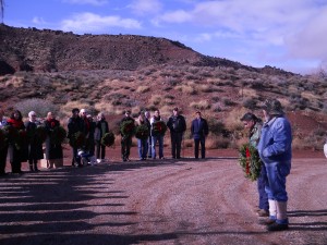 Clarence "Beans" John stands in front of guests, holds a wreath and talks about the importance of honoring fallen veterans at the Shivwits Cemetery, on the Shivwits Indian Reservation, Utah, Dec. 13, 2014 | Photo by Aspen Stoddard, St. George News