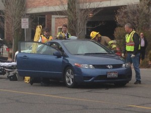 St. George firefighters  extricate a woman from her car at the scene of an accident on Tabernacle Street, St. George, Utah, Dec. 17, 2014 | Photo by Holly Coombs, St. George News