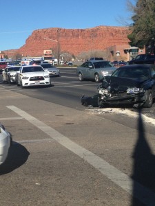 A Honda passenger car sits in the middle of an intersection after its involvement in a two-vehicle collision, St. George, Utah, Dec. 23, 2014 | Photo by Holly Coombs, St. George News