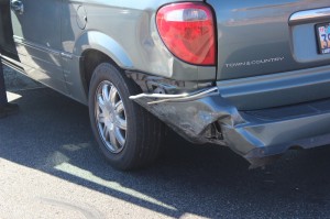 The damage to the back end of a Chrysler Town & Country following an accident at the intersection of 1400 West and Snow Canyon Parkway, St. George, Utah | Photo by Devan Chavez, St. George News