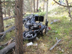 Motorcycle crashes into felled tree on state Route 12 about halfway between Boulder in Garfield County and Torrey in Wayne County, Utah, Oct. 11, 2014 | Photo courtesy of Utah Highway Patrol, St. George News