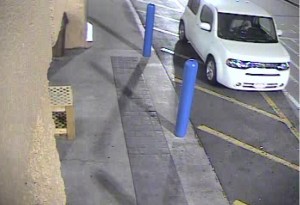 A white Nissan Cube is identified as the suspect vehicle at the entrance of Wal-Mart, Cedar City, Utah, Dec. 9, 2014| Photo courtesy of Cedar City Police Department, for St. George News