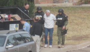 Guy Fotheringham being escorted by police following his arrest, St. George, Utah, Dec. 2, 2014 | Photo by Mori Kessler, St. George News.