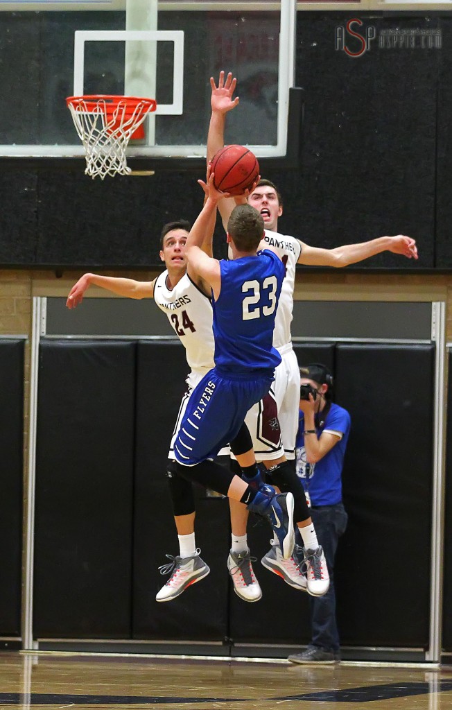 Flyer F Jake Hawes (23) puts up the game winning shot over Jed Newby (24) and Kody Wilstead, Dixie vs. Pine View, Boys Basketball, St. George, Utah, Jan. 7, 2015 | Photo by Robert Hoppie, ASPpix.com, St. George News