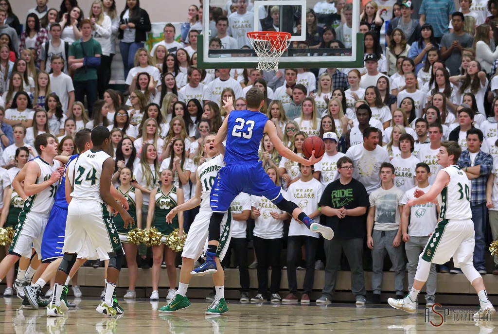 Dixie F Jake Hawes (23) floats to the hoop in front of the Snow Canyon student section, Dixie vs. Snow Canyon, Boys Basketball,  St. George, Utah, Jan. 16, 2015 | Photo by Robert Hoppie, ASPpix.com, St. George News