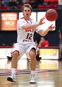 Mason Sawyer (12) dishes to a teammate, Dixie State University vs. California Baptist University, Mens Basketball,  St. George, Utah, Jan. 19, 2015 | Photo by Robert Hoppie, ASPpix.com, St. George News