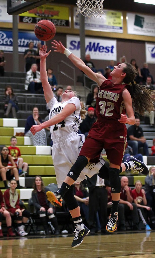 Desert Hills' Ashley Beckstrand puts up a layup with Cedars Morgan Myers (32) defending,  Cedar vs. Desert Hills, Girls Basketball,  St. George, Utah, Jan. 22, 2015 | Photo by Robert Hoppie, ASPpix.com, St. George News