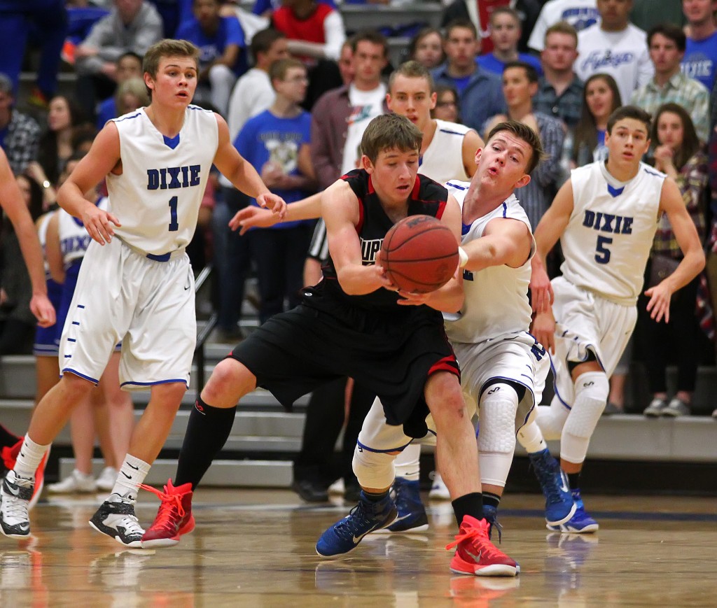 Hurricane's Reagan Hinton and Dixie's Izaic Blazzard battle for a loose ball, Hurricane vs. Dixie, Boys Basketball,  St. George, Utah, Jan. 23, 2015 | Photo by Robert Hoppie, ASPpix.com, St. George News