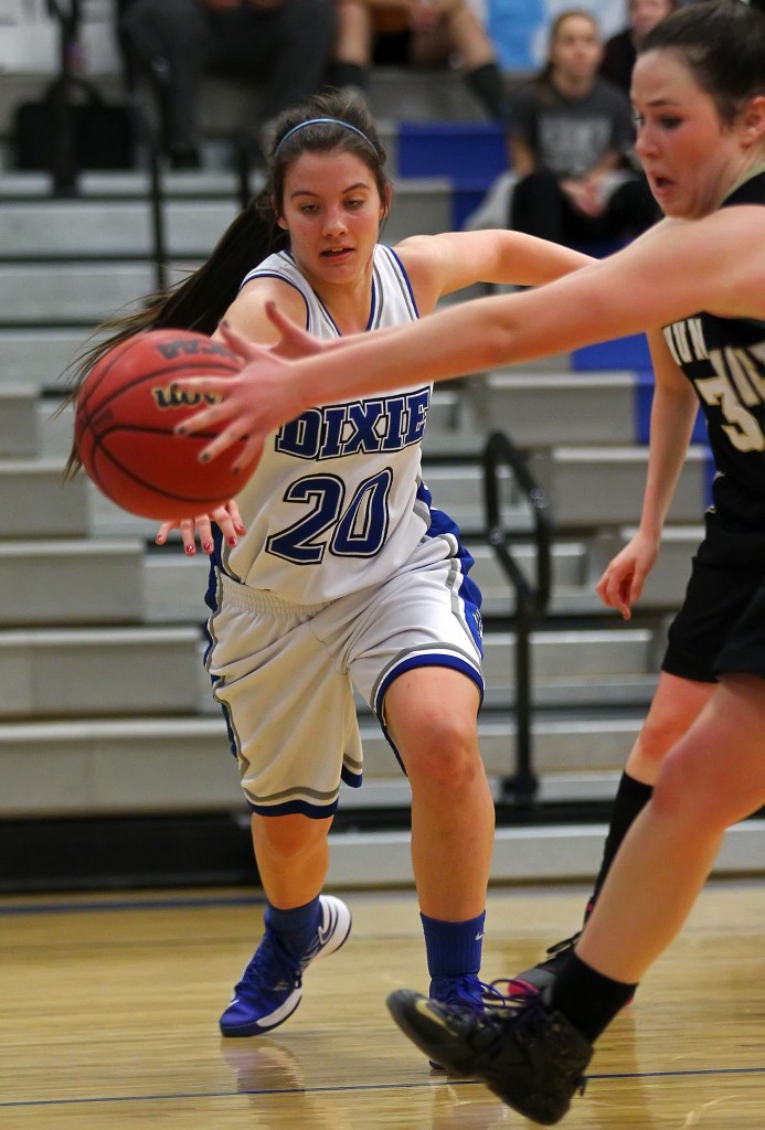 Taylor Whitson (20) and Ashlynne Drew reach for a loose ball, Desert Hills vs. Dixie, Girls Basketball, St. George, Utah, Jan. 27, 2015 | Photo by Robert Hoppie, ASPpix.com, St. George News