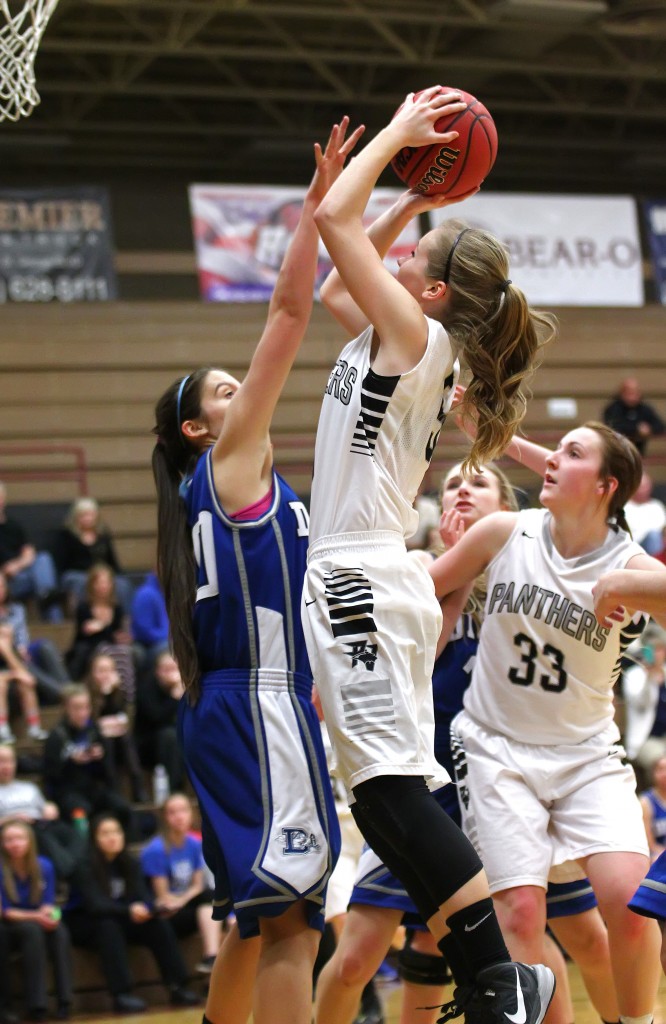 Pine View's Amber Archibald puts a shot over Dixie's Taylor Whitson, Dixie vs. Pine View, Girls Basketball, St. George, Utah, Jan. 29, 2015 | Photo by Robert Hoppie, ASPpix.com, St. George News