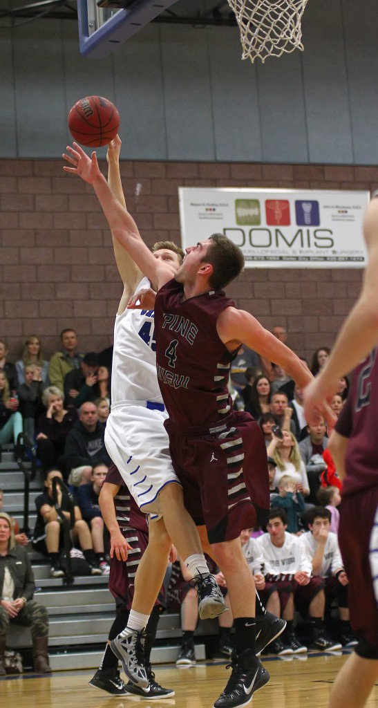 Pine View's Kody Wilstead (4) blocks the shot of Dixie's Richard Guymon, Pine View vs. Dixie, Boys Basketball, St. George, Utah, Jan. 30, 2015 | Photo by Robert Hoppie, ASPpix.com, St. George News