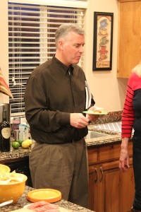 State Democratic Chair, Peter Corroon, enjoys a snack while speaking to other democratic party members at the Talk and Tapas event, Hurricane, Utah, Jan. 11, 2014 | Photo by Devan Chavez, St. George News