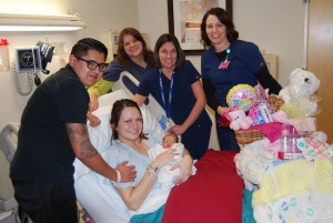 The parents and newborn baby pose with staff at Valley View Medical Center after the family was given  gift baskets, Valley View Medical Center, Cedar City Utah, Jan. 1, 2015 | Photo courtesy of Valley View Medical Center, St. George News 