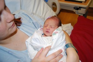 First-time mother, Rachel Cantu, cradles her new daughter, Brooklynn Rosaura Lazaro, Valley View Medical Center, Cedar City, Utah, Jan. 1, 2015 | Photo courtesy of Valley View Medical Center, St. George News 