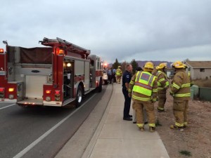 Emergency responders gather after a  car crashed into a shed on South Dixie Drive, St. George, Utah, Jan. 20, 2015 | Photo courtesy of Melissa Anderson, St. George News