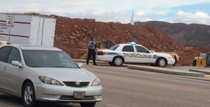 An officer stand by his patrol car blocking an entrance into the Goldenwest Credit Union parking lot. He and other officers are responding to a potential incident inside the credit union that turned out to be a false alarm, St. George, Utah, Jan. 30, 2015 | Reader-submitted photo, St. George News