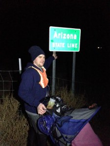 Joshua Bryant at the Arizona-Utah state line, where he prepares to run to Idaho in eight days, near St. George, Utah, Jan. 21, 2015 | Photo courtesy of Joshua Bryant, St. George News