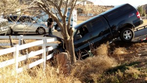 The damaged Ford pickup truck stuck in the ditch by 2800 South and River Road, St. George, Utah, Feb. 12, 2015 | Photo by Mori Kessler, St. George News