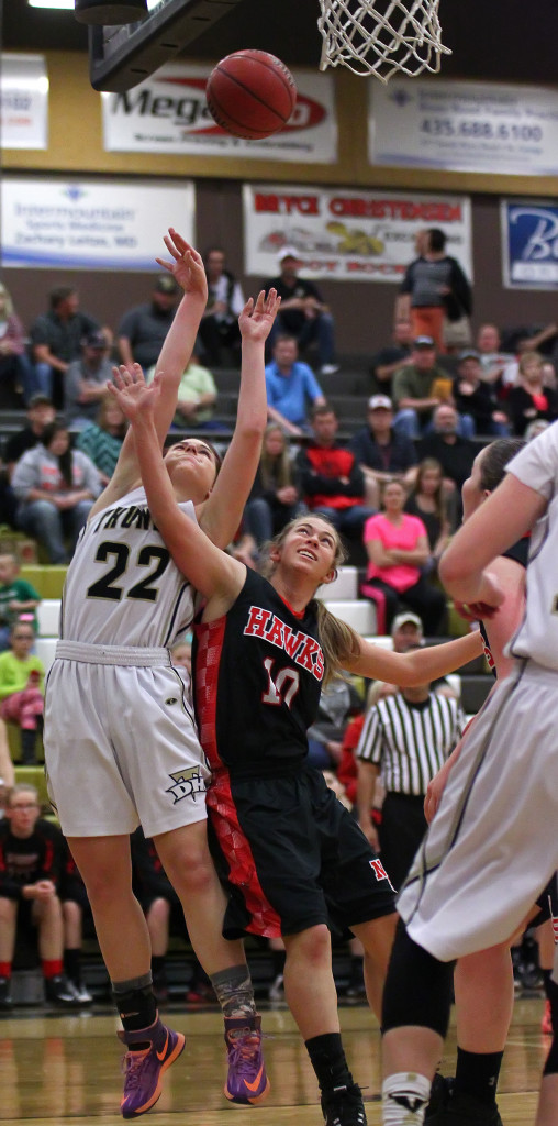 Kendyl Larson (22) is fouled on a shot in the paint, North Sanpete vs. Desert Hills, Girls Basketball, St. George,  Utah, Feb. 21, 2015 | Photo by Rober Hoppie, ASPpix.com, St. George News