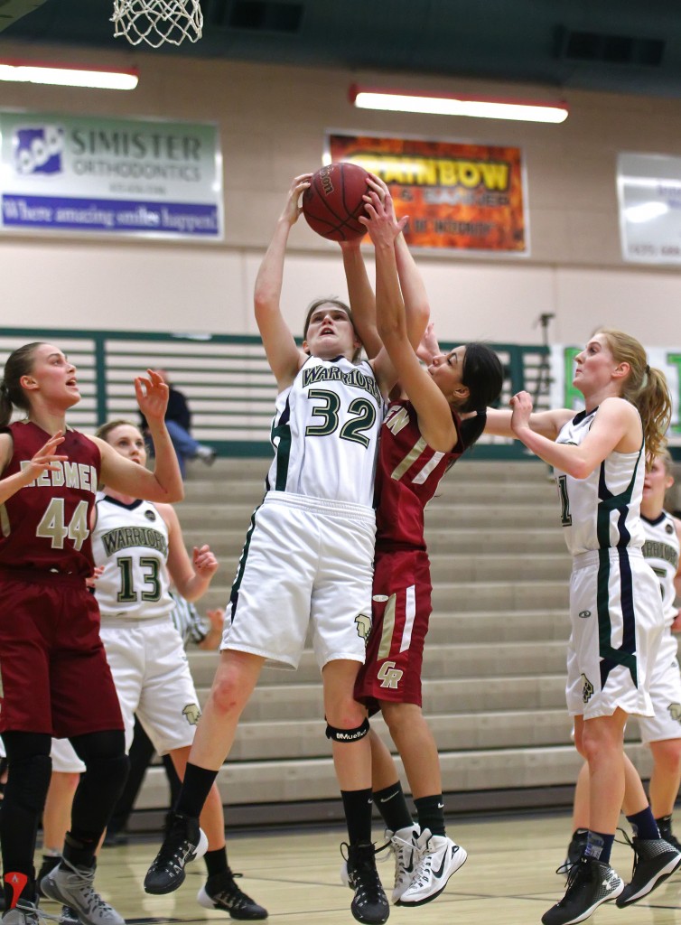 Snow Canyon's Lindsy McConnell (32) grabs a rebound, Cedar vs. Snow Canyon, Girls Basketball, St. George, Utah, Feb. 3, 2015 | Photo by Robert Hoppie, ASPpix.com, St. George News