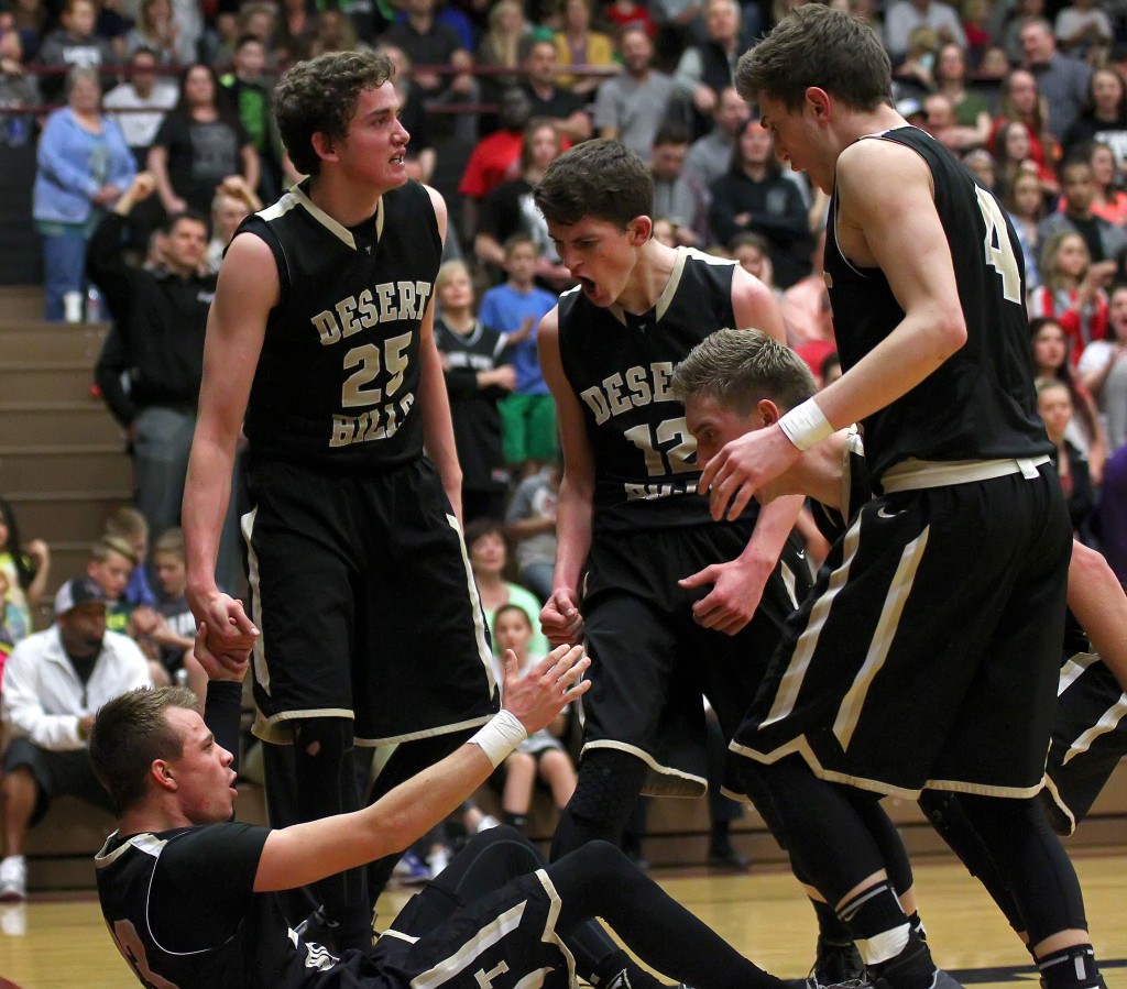 Max Mills gets help from his Thunder teammates after taking a charge, Desert Hills vs. Pine View, Boys Basketball, St. George, Utah, Feb. 4, 2015 | Photo by Robert Hoppie, ASPpix.com, St. George News