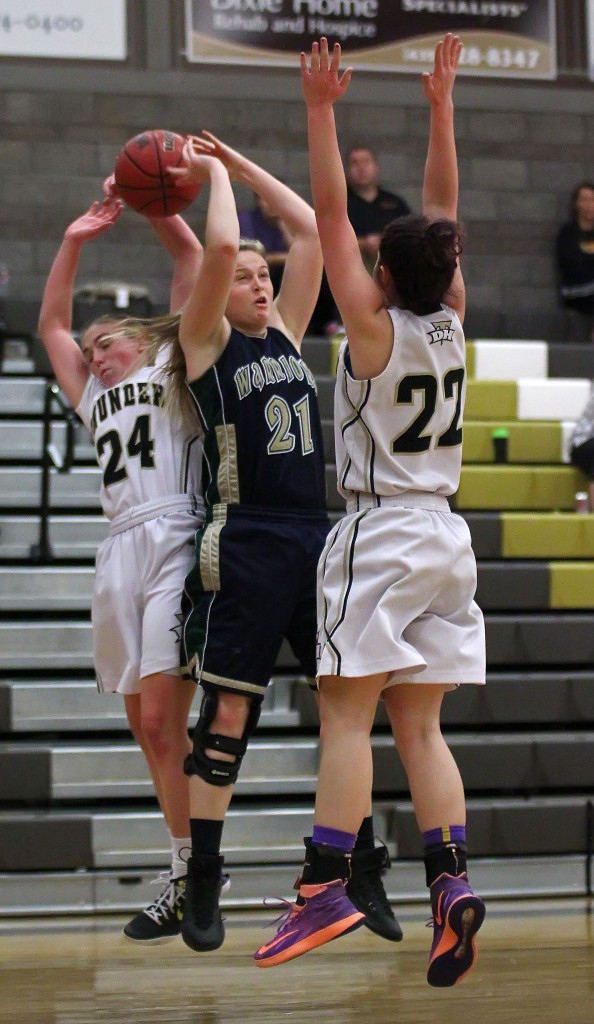 Thunder G Ashley Beckstrand (24) grabs the ball from Warrior G Madison Mooring (21), Snow Canyon vs. Desert Hills, Girls Basketball, St. George, Utah, Feb. 5, 2015 | Photo by Robert Hoppie, ASPpix.com, St. George News