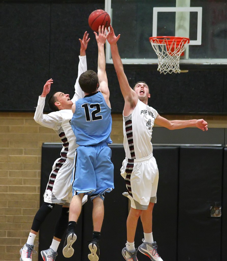 Jed Newby and Kody Wilstead (4) contest a jumper by Falcon F Derek Dunnell (12), Pine View vs. Canyon View, Boys Basketball, St. George, Utah, Feb. 6, 2015 | Photo by Robert Hoppie, ASPpix.com, St. George News