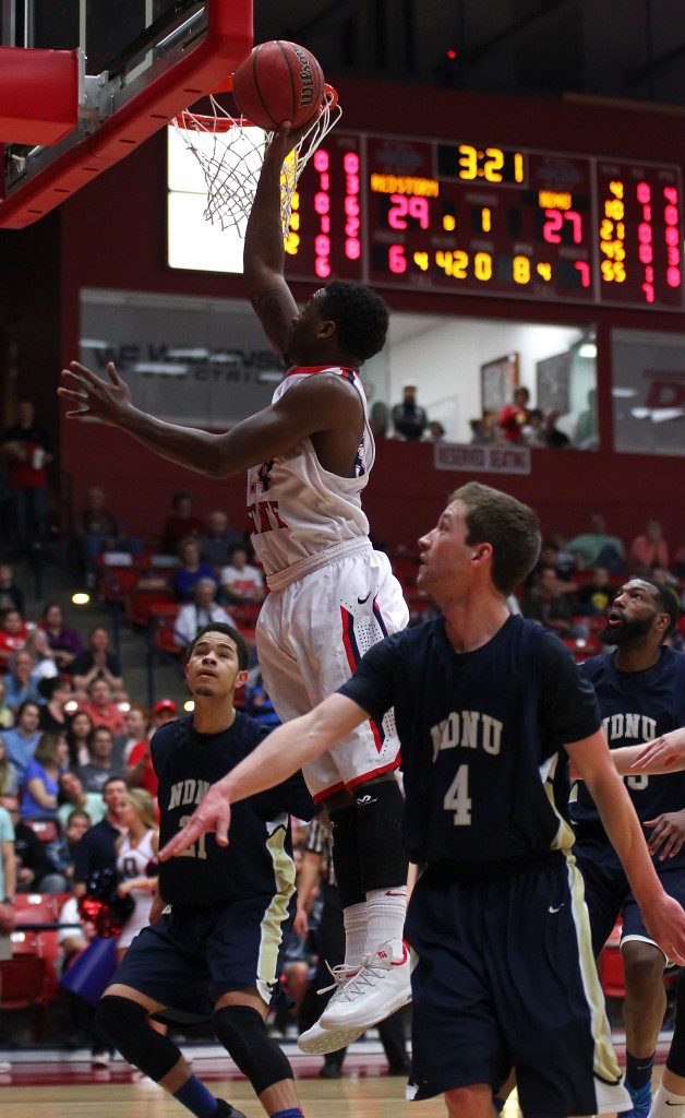 DeQuan Thompson drives to the hoop for the Red Storm, Dixie State University vs. Notre Dame De Namur, Mens Basketball, St. George, Utah, Feb. 7, 2015 | Photo by Robert Hoppie, ASPpix.com, St. George News