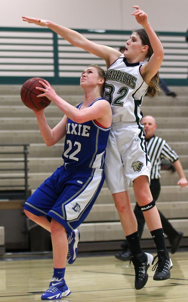 Alexa Estridge (22) is fouled by Lindsy McConnell (32) on a layup attempt, Dixie vs. Snow Canyon, Girls Basketball, St. George, Utah, Feb. 10, 2015 | Photo by Robert Hoppie, ASPpix.com, St. George News