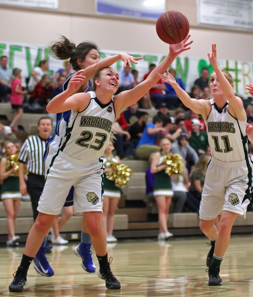 Lady Warriors Christee Wilson (23) and Nikenna Durante (11) reach for a loose ball, Dixie vs. Snow Canyon, Girls Basketball, St. George, Utah, Feb. 10, 2015 | Photo by Robert Hoppie, ASPpix.com, St. George News