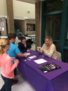 Representaives for the Canyon Creek Women' Crisis Center pass out information regarding Teen Dating Violence Awareness month at last year's event, Cedar City, Utah, Feb. 5, 2014 | Photo courtesy of the Canyon Creek Women's Crisis Center, St. George News