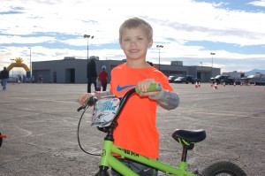 Trevin Kirk, 4, is all smiles after completing his race at the Move It! Kids criterium held at the Ridge Top Complex, St. George, Utah, Feb. 7, 2015 | Photo by Hollie Reina, St. George News