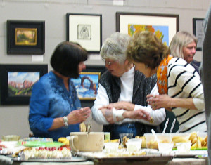 Friendly chatter around the dessert table, Artisans Art Gallery, Cedar City, Utah, Feb. 21, 2015 | Photo by Carin Miller, St. George News