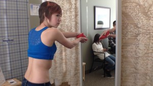 Ella Christilaw, 13, watches in the side mirror as she works through her physical therapy exercises to improve her scoliosis condition, St. George, Utah, Feb. 12, 2015 |Photo by Holly Coombs, St. George News