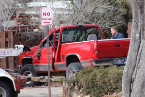 Officials asses how best to remove the truck involved in an accident in front of Cedar City High School, 550 W. 600 South, Cedar City, Utah, Feb. 3, 2015 | Photo by Devan Chavez, St. George News