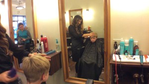 A boy receives a haircut at the "Cuts for Kycie" fundraiser, St. George, Utah, Feb. 22, 2015 | Photo by Holly Coombs, St. George News