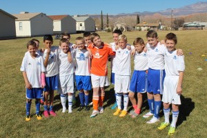 The Aggies FC youth soccer team from Logan poses for a team photo before their final game for the top spot in the Ice Breaker tournament, Washington City Community Center, Washington City, Utah, Feb. 16, 2015 | Photo by Devan Chavez, St. George News 