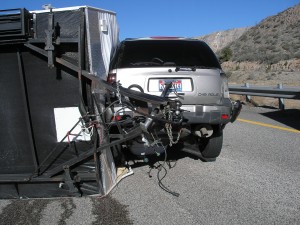 A camp trailer lays on its left side following its crash on I-15, near Toquerville, Utah, Feb. 17, 2015 | Photo courtesy of Utah Highway Patrol, St. George News