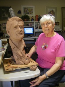 L'Deane Trueblood, renowned local artist poses with her sculpture, St. George, Utah, undated | Photo courtesy of Dixie State University, St. George News