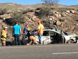 Emergency workers assess the damage of a Hyundai involved in an accident with a semi truck on Interstate-15, Washington County, Utah, March 10, 2015 | Photo by Devan Chavez, St. George News