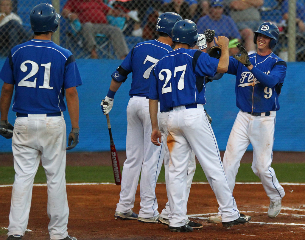 Colin Hutchings (9) gets congratulations from his teammates after his 3-run home run, Fremont vs. Dixie, Dixie Sunshine Classic championship game, Baseball, St. George, Utah, Mar. 14, 2015 | Photo by Robert Hoppie, ASPpix.com, St. George News