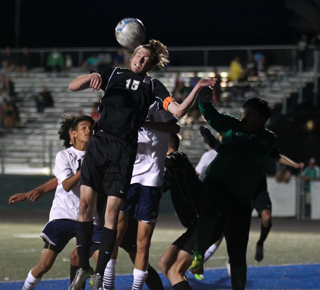 Pine View's Ethan Baer (15) heads the ball out of danger, Pine View vs. Snow Canyon, boys soccer, St. George, Utah, Mar. 17, 2015 | Photo by Robert Hoppie, ASPpix.com, St. George News