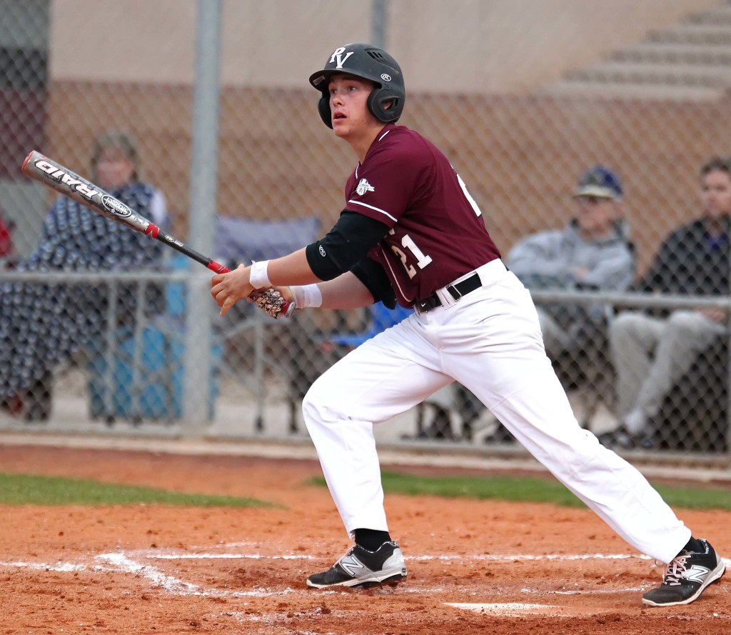 Brooks Barney (21) puts a ball in play for the Panthers, Snow Canyon vs. Pine View, baseball, St. George, Utah, Mar. 18, 2015 | Photo by Robert Hoppie, ASPpix.com, St. George News