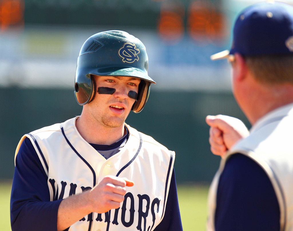 Isaac Rhea and head coach Reed Secrist meet up at third base, Canyon View vs. Snow Canyon, Baseball, St. George, Utah, Mar. 7, 2015 | Photo by Robert Hoppie, ASPpix.com, St. George News