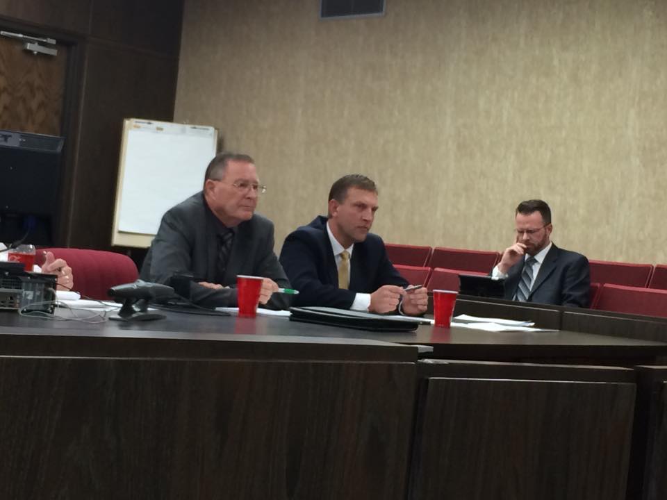 Iron County Commissioners Dale Brinkerhoff (left) and David Miller (center) prepare to announce their decision on the Ambulance Service as Deputy County Attorney Mike Edwards (right) checks his computer, Parowan, Utah, March 9, 2015 | Photo by Devan Chavez, St. George News