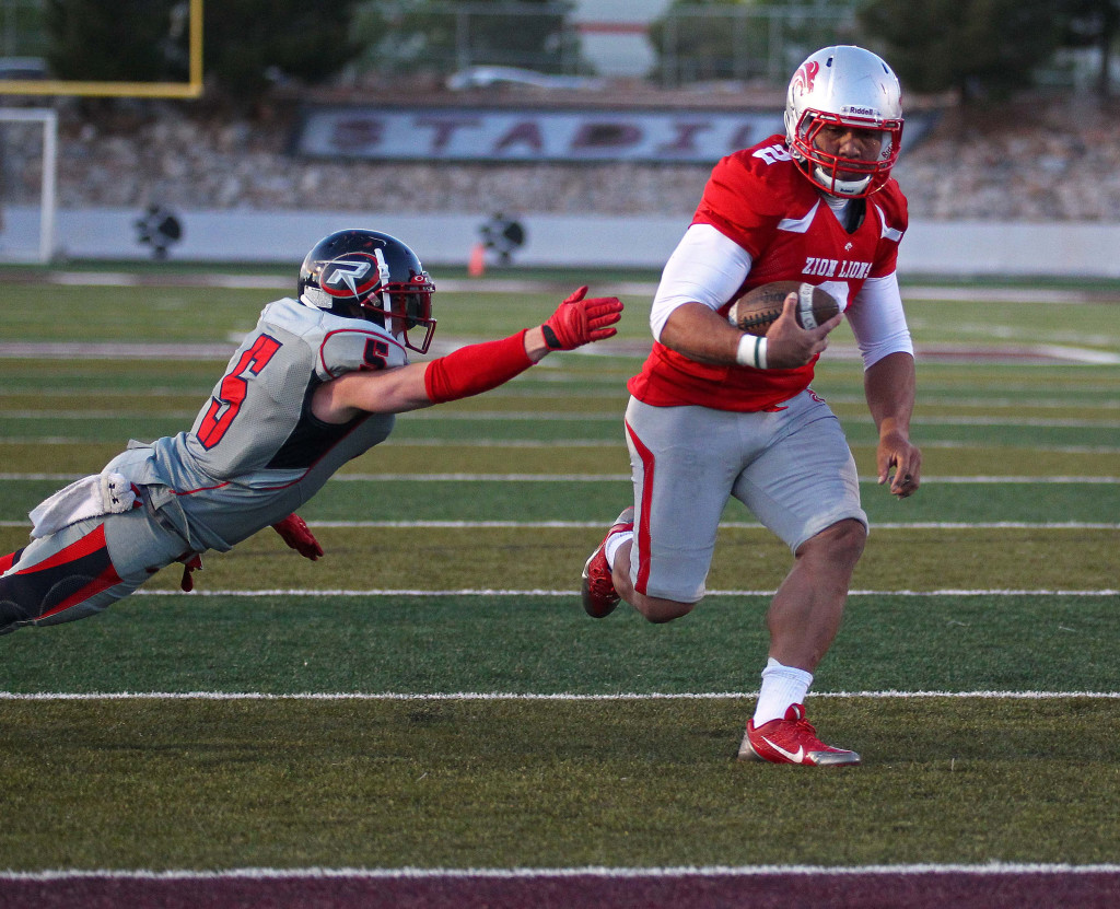 Misi Tupe (2) finds a hole and scores for the Lions, Zion Lions vs. Wasatch Revolution, Football, St. George, Utah, Apr. 11, 2015 | Photo by Robert Hoppie, ASPpix.com, St. George News