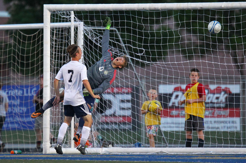 Warrior goalkeeper Braydon Brough leaps as the ball flies past him for a Dixie goal, Dixie vs. Snow Canyon, Soccer, St. George, Utah, Apr. 21, 2015 | Photo by Robert Hoppie, ASPpix.com, St. George News