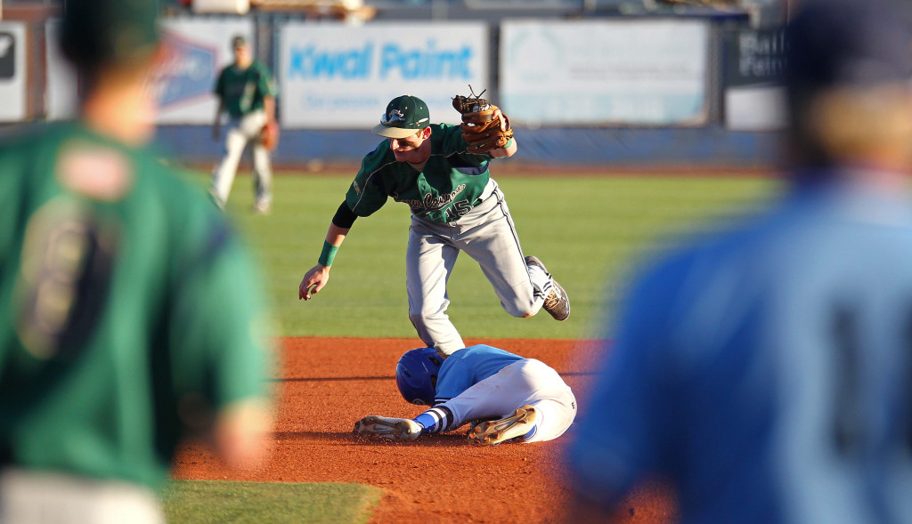 Warrior shortstop Brad Grisenti (15) tags out Dixie's Hobbs Nyberg on a steal attempt, Snow Canyon vs. Dixie, Baseball, St. George, Utah, Apr. 27, 2015 | Photo by Robert Hoppie, ASPpix.com, St. George News