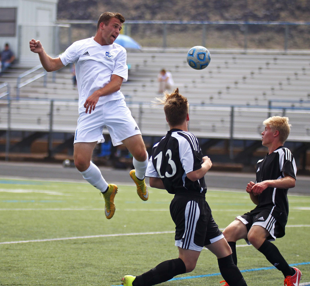 McLane Keenan with a header for the Flyers, Dixie vs. Union, Soccer, St. George, Utah, Apr. 30, 2015 | Photo by Robert Hoppie, ASPpix.com, St. George News